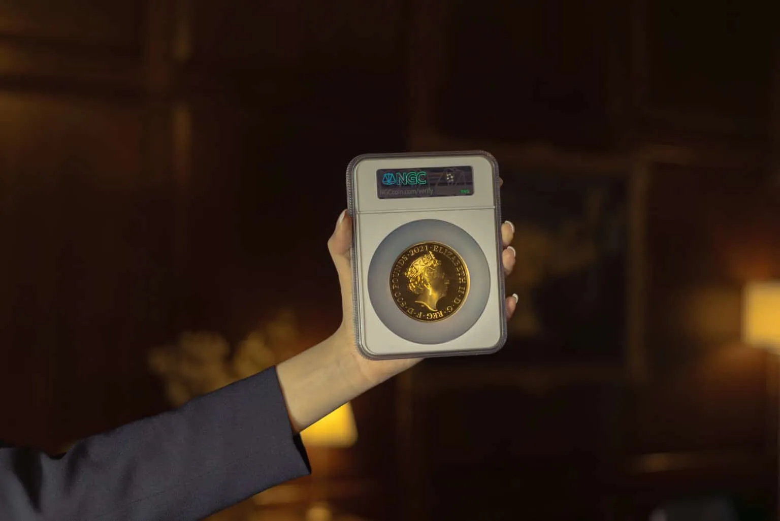 A graded gold coin sealed in an NGC holder